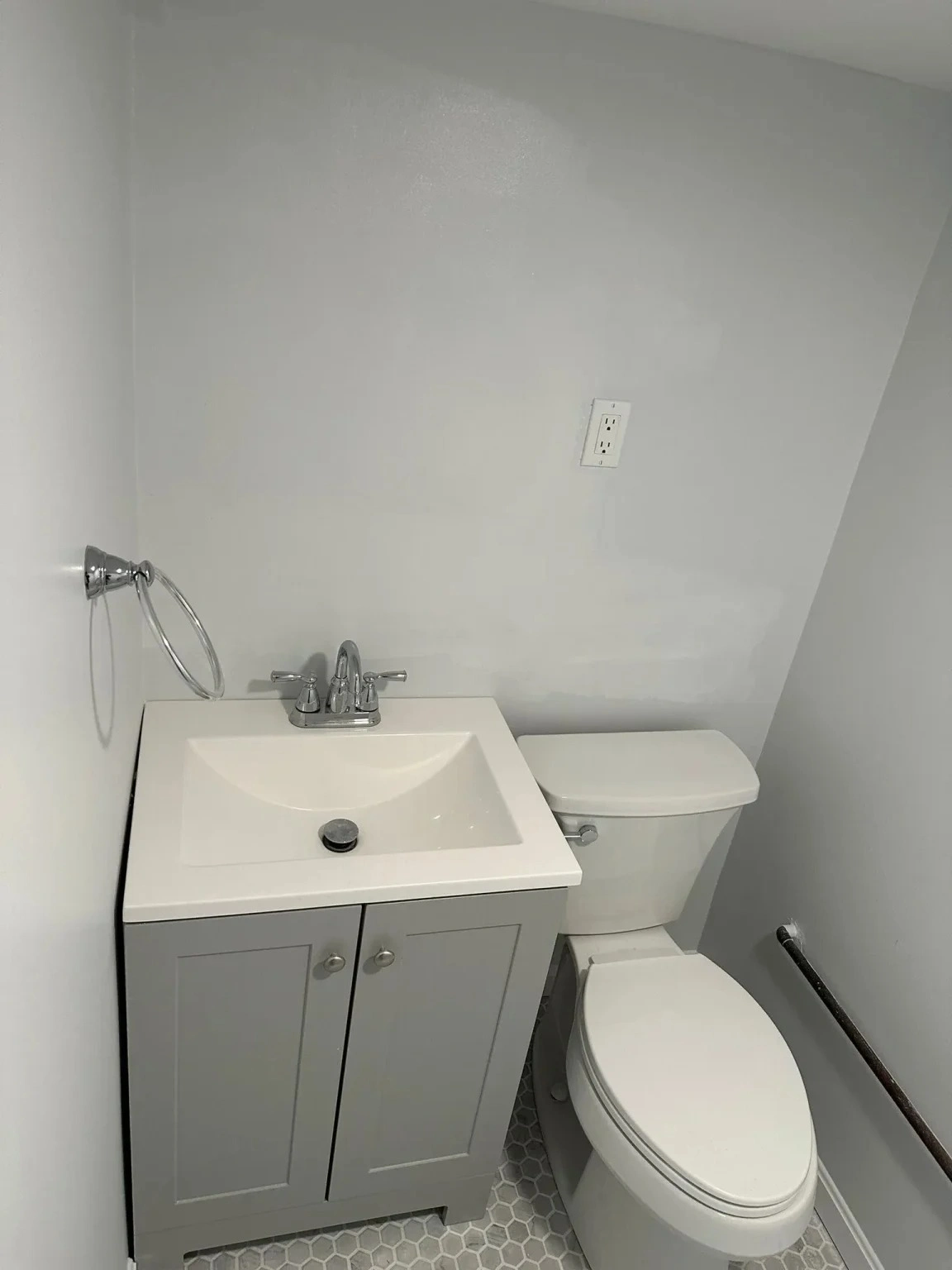 A professional toilet and sink installation in Baltimore, MD with modern fixtures.