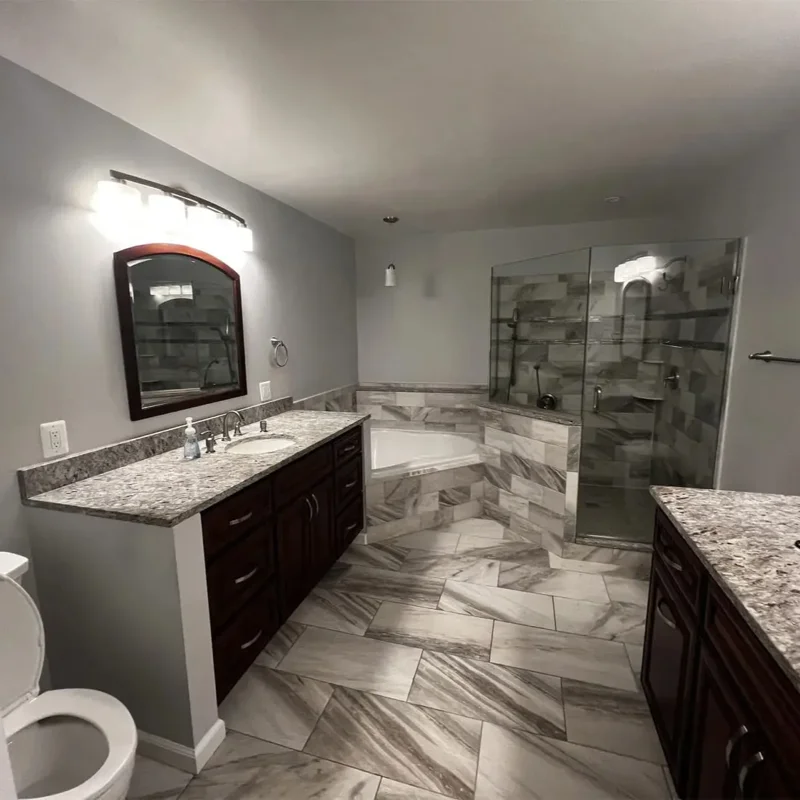 Custom bathroom remodel with walk-in shower and dual vanity in Gambrills, MD