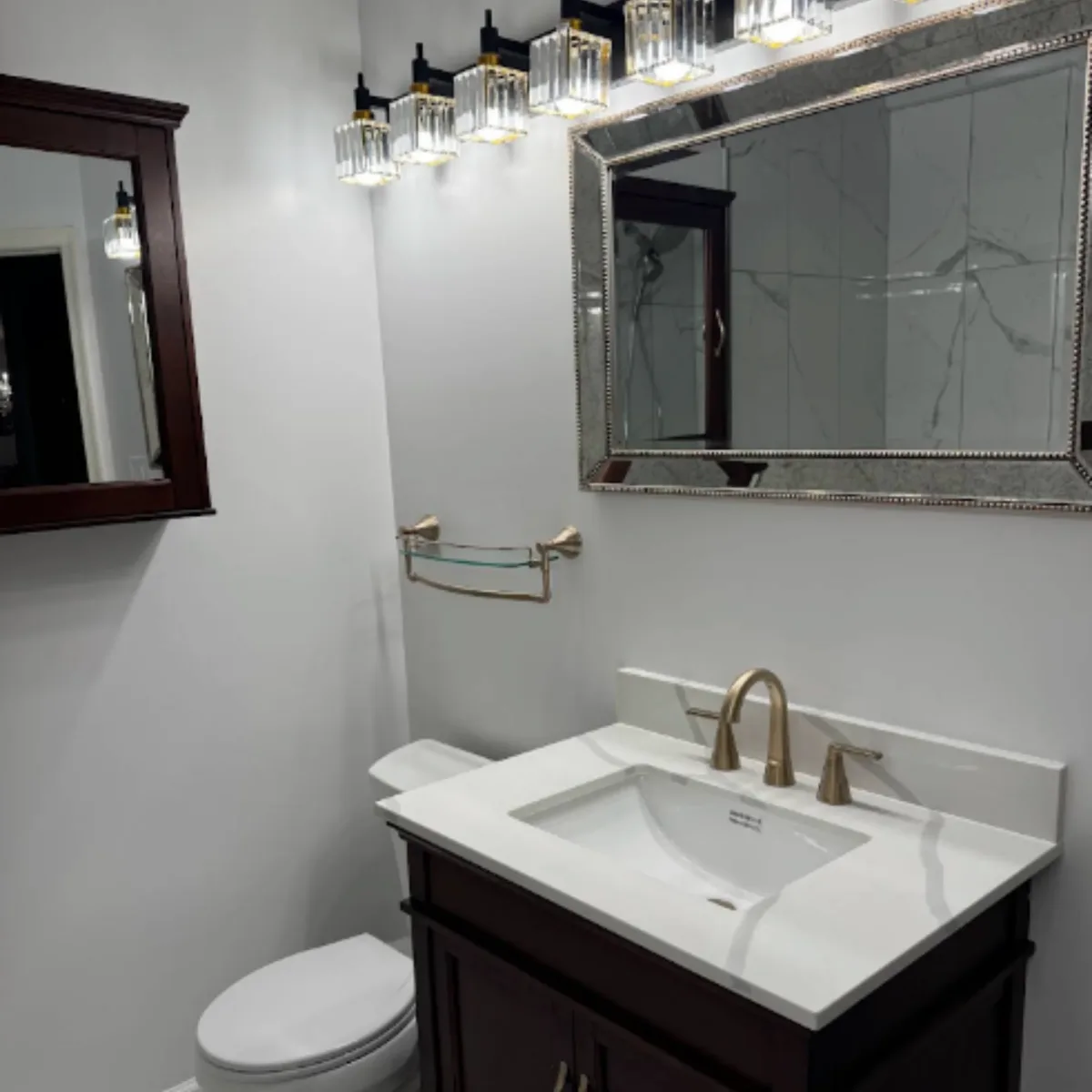 Quartz vanity countertop with an undermount sink and brass faucet in Columbia