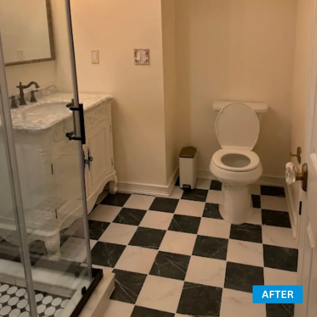 Powder room with a glossy black and white checkerboard tile floor and a marble top vanity