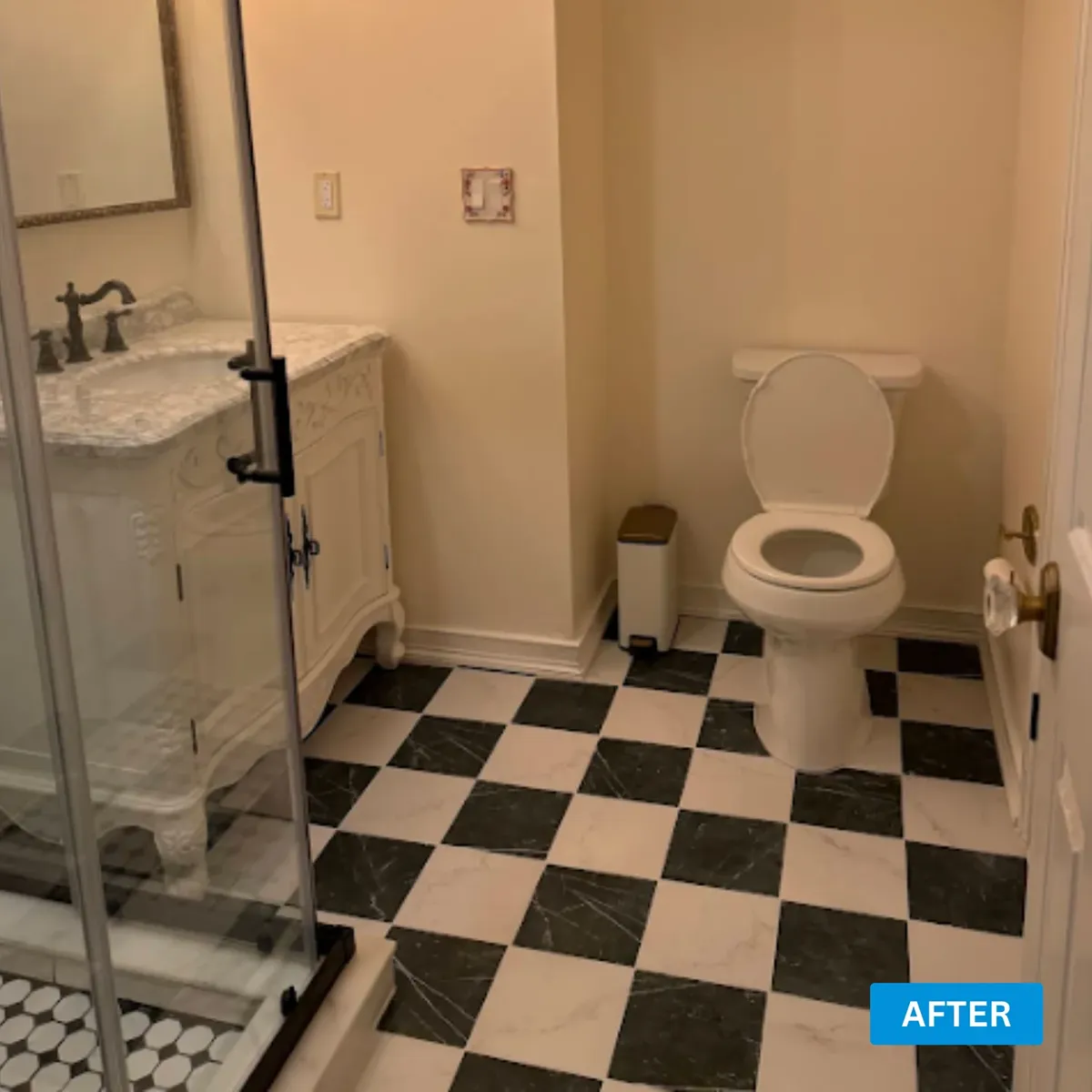 Powder room with a glossy black and white checkerboard tile floor and a marble top vanity