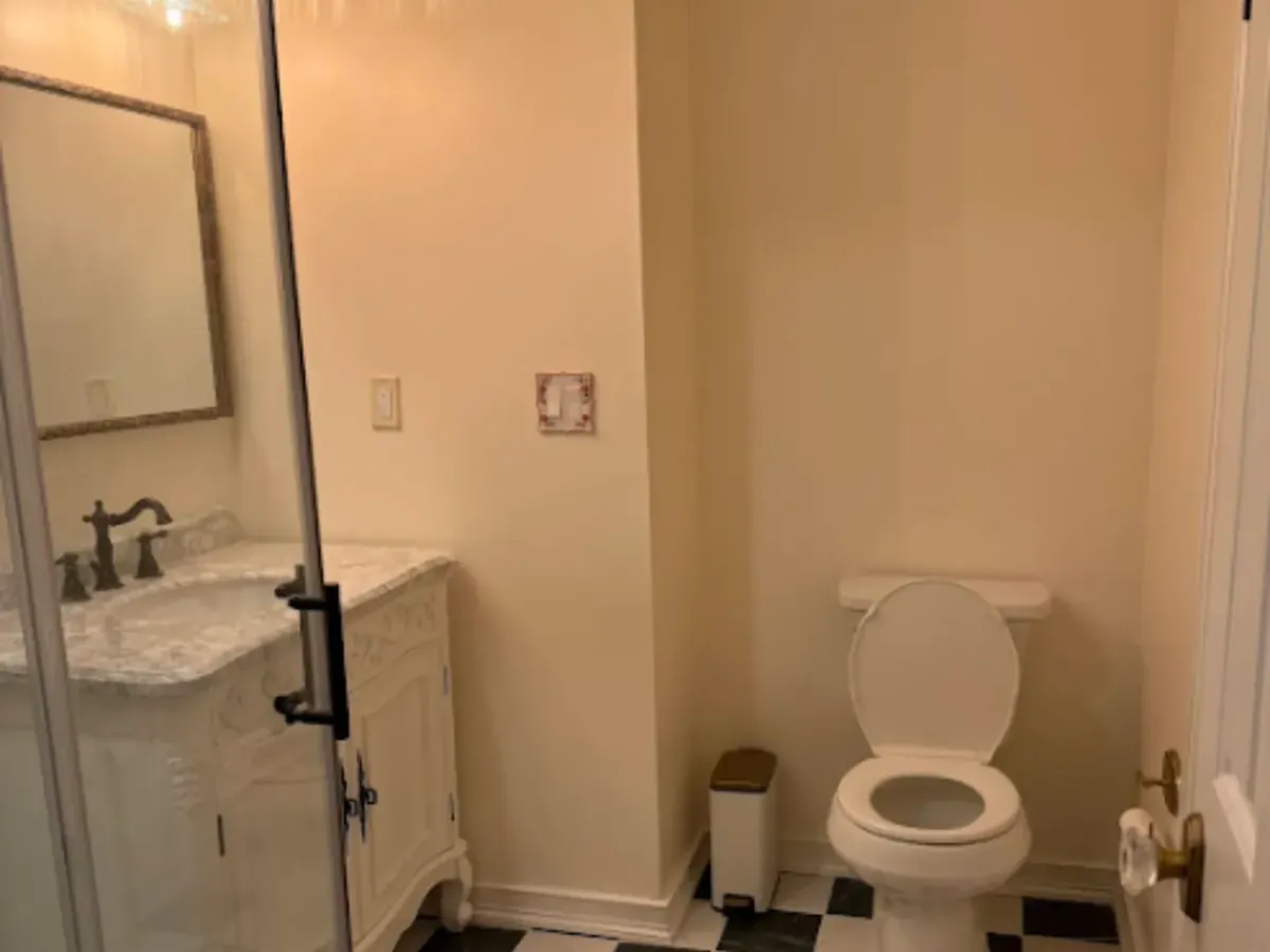 Clear floor space beside the toilet and a wide doorway in an accessible bathroom remodel in Arnold MD