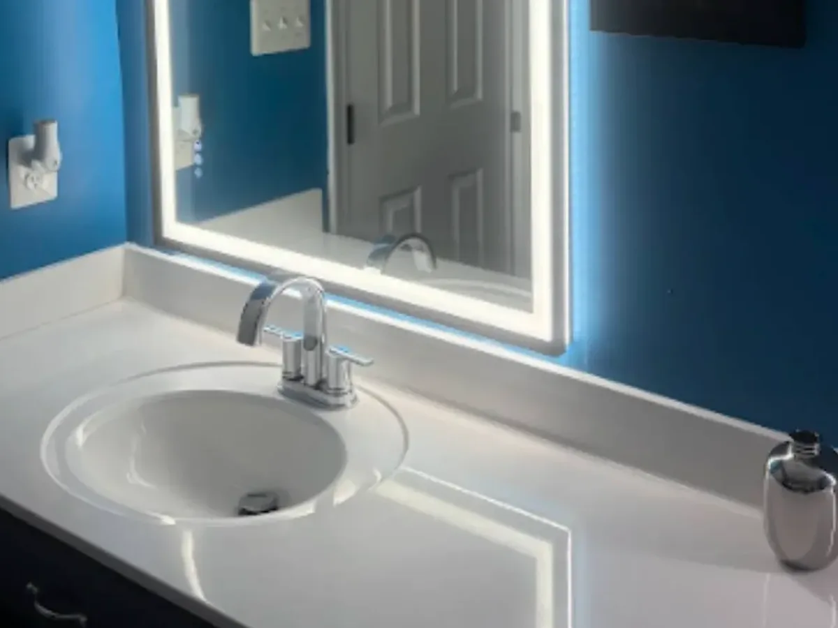 White vanity top with a new sink and faucet after bathroom plumbing in an Arnold MD remodel