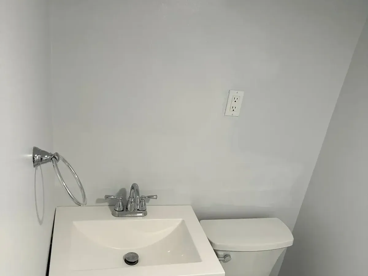 Compact sink and toilet layout with a new supply line in a Columbia MD bathroom plumbing job